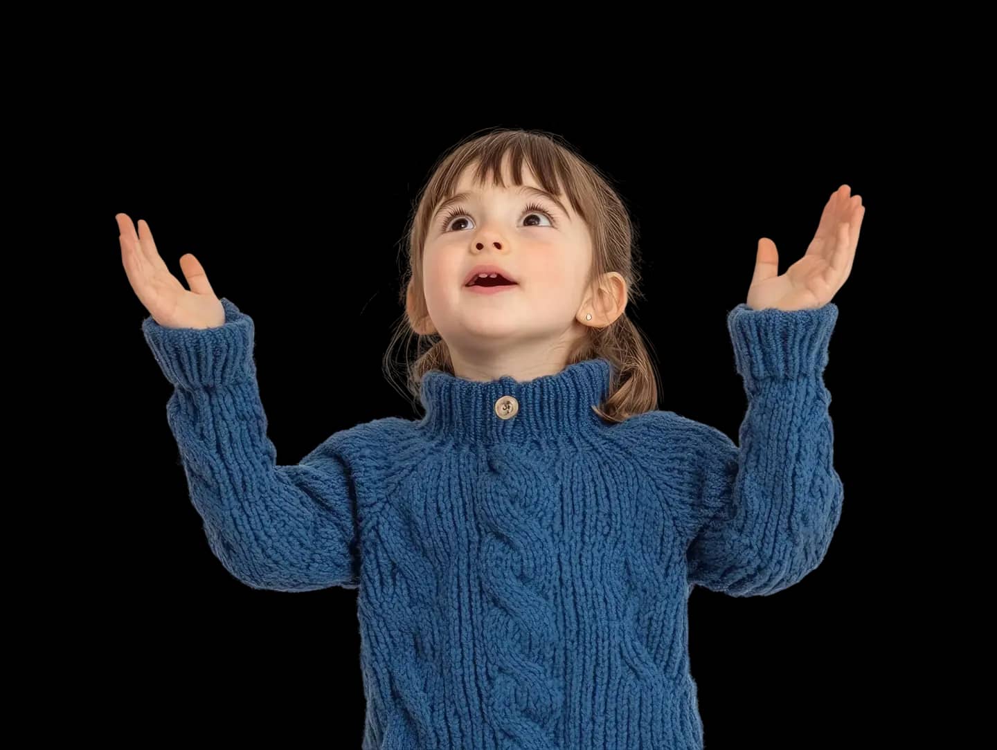 Child smiling in a blue sweater